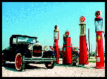 Picture of old auto at pumps